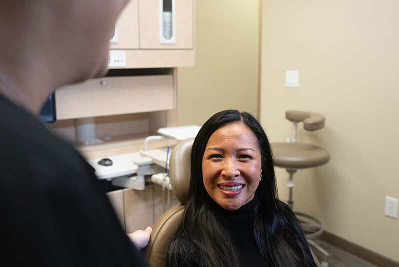 patient smiling showing off new veneers