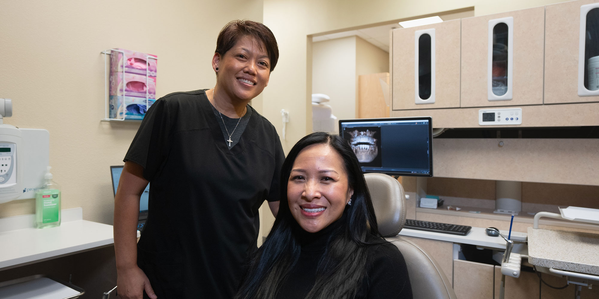patient smiling with team member after consultation