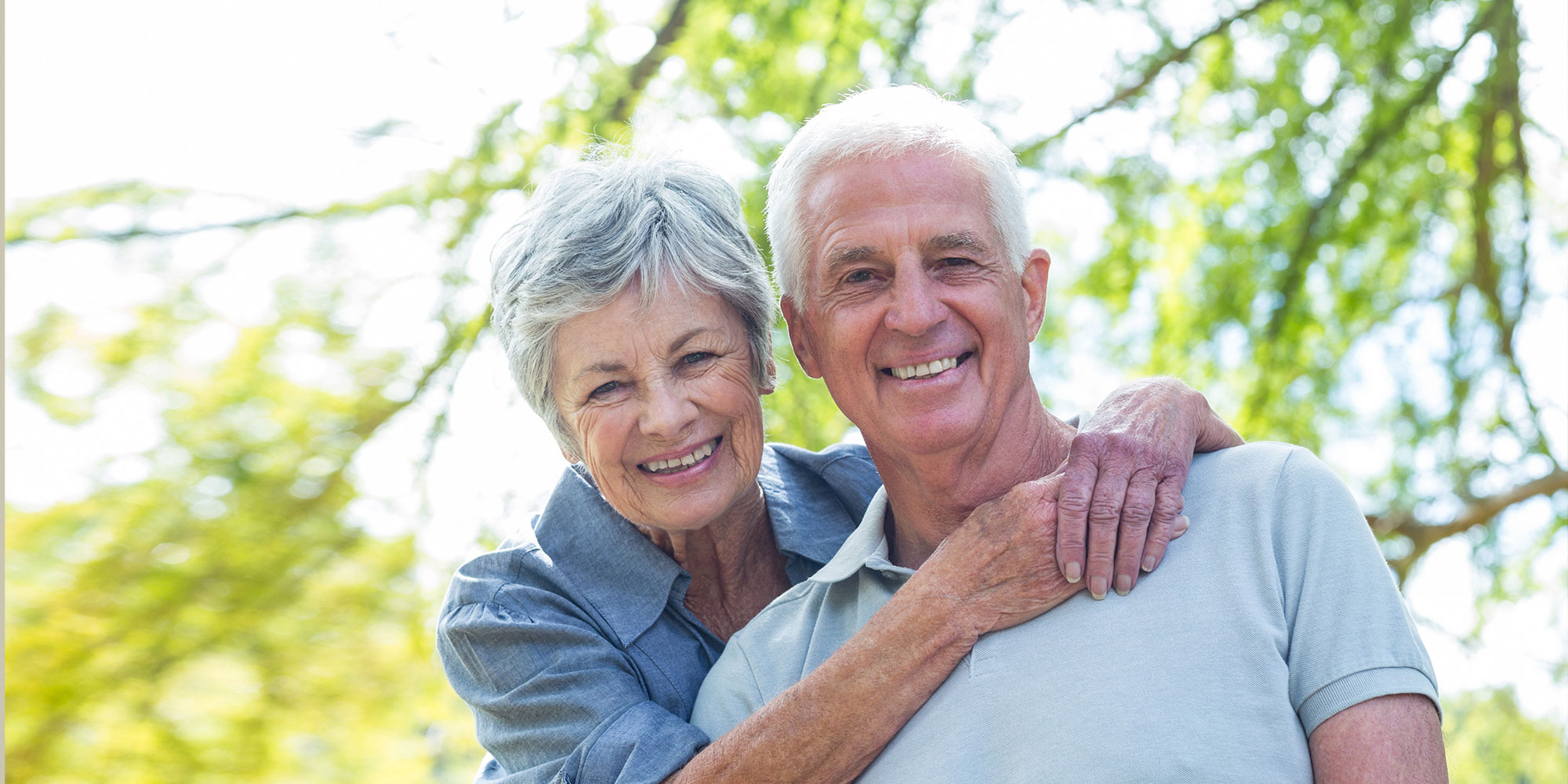 couple smiling showing off dentures
