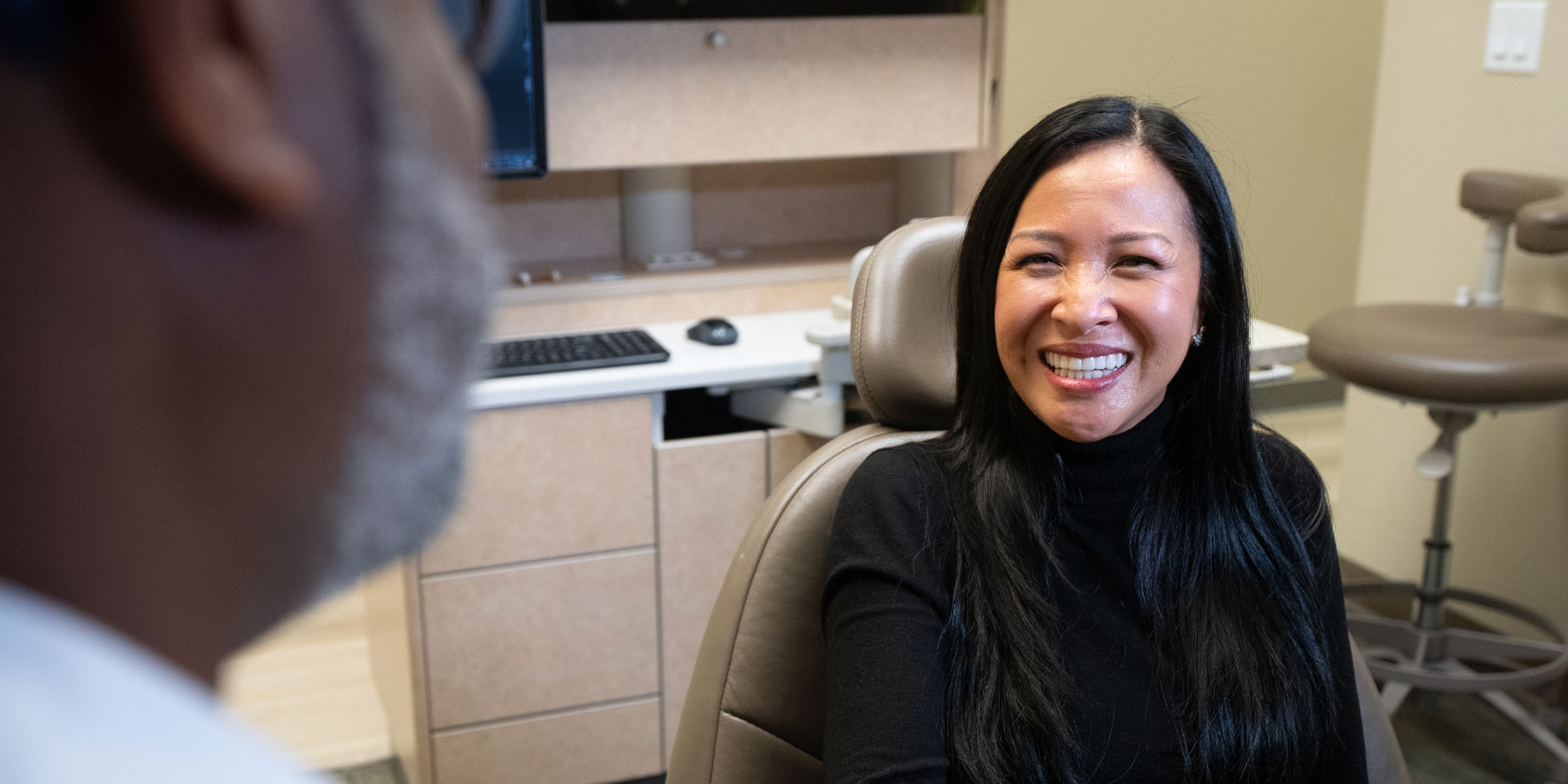 patient smiling after laser gum disease therapy