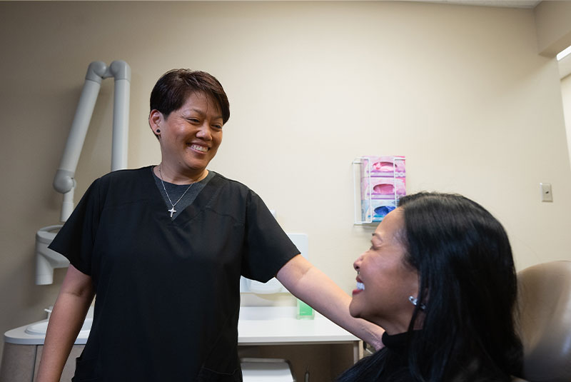 team member having a consultation with patient about veneers process
